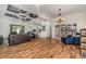 Open-concept living room features stylish wood floors, a coffered ceiling, and an open view to the kitchen at 2707 Auburn Blvd, Port Charlotte, FL 33948