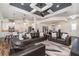 Open living area with a coffered ceiling, comfortable furniture, and a seamless flow to the kitchen at 2707 Auburn Blvd, Port Charlotte, FL 33948