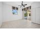Bedroom featuring tile flooring, and sliding glass doors that lead to a screened lanai with pool views at 2719 Mayaguana Ct, Punta Gorda, FL 33950