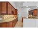 Spacious kitchen featuring custom wood cabinets, granite countertops, and modern appliances at 2719 Mayaguana Ct, Punta Gorda, FL 33950