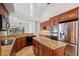 Gourmet kitchen with granite countertops, stainless steel appliances, and ample cabinet space at 2719 Mayaguana Ct, Punta Gorda, FL 33950