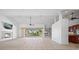 Expansive living space with fireplace, tile flooring, and a view of the pool at 2719 Mayaguana Ct, Punta Gorda, FL 33950