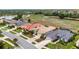 Aerial view of a charming neighborhood with well-maintained homes, and a scenic waterway in the background at 2913 Royal Palm Dr, North Port, FL 34288