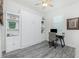 Versatile bedroom featuring built-in shelving, desk, and a space-saving Murphy bed at 2913 Royal Palm Dr, North Port, FL 34288