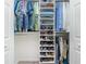 Well-organized walk-in closet with shelves, hanging rods, and shoe racks at 2913 Royal Palm Dr, North Port, FL 34288