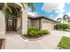 Inviting single-story home featuring a two-car garage, stucco exterior, and a well-manicured lawn at 2913 Royal Palm Dr, North Port, FL 34288