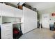 Garage interior with custom cabinets, work area, and a clean, well-lit space at 2913 Royal Palm Dr, North Port, FL 34288