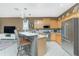 Well-equipped kitchen with granite countertops, stainless steel appliances and adjacent breakfast bar at 2913 Royal Palm Dr, North Port, FL 34288