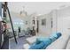 Bright living area with stylish seating, statement lighting, and easy access to the front door at 2913 Royal Palm Dr, North Port, FL 34288