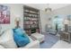 Comfortable living room with stylish furnishings, a tall bookshelf, and plenty of natural light at 2913 Royal Palm Dr, North Port, FL 34288