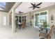 Outdoor patio with ceiling fans and sliding glass doors for ideal indoor/outdoor living at 2913 Royal Palm Dr, North Port, FL 34288