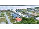 Aerial view captures canal-front homes in a waterfront community, with serene water views at 3058 Curry Ter, Port Charlotte, FL 33981