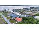 A tranquil waterfront community with charming homes nestled along a network of canals at 3058 Curry Ter, Port Charlotte, FL 33981
