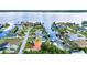 Waterfront property featuring canal access, boat docks, and lush greenery surrounding the homes at 3058 Curry Ter, Port Charlotte, FL 33981