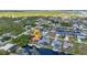 Stunning aerial view of a waterfront community with private docks, boat lifts, and scenic water access at 3058 Curry Ter, Port Charlotte, FL 33981