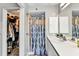 Clean bathroom featuring a shower, closet, and vanity with modern fixtures at 3058 Curry Ter, Port Charlotte, FL 33981