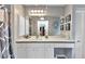 Bright bathroom with a long vanity, a large mirror, and ample storage space at 3058 Curry Ter, Port Charlotte, FL 33981