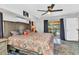 Comfortable bedroom with a ceiling fan and sliding doors to a patio and pool at 3058 Curry Ter, Port Charlotte, FL 33981