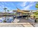 Dock with a boat lift, providing convenience for waterfront activities at 3058 Curry Ter, Port Charlotte, FL 33981