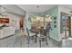 Bright breakfast nook with a table, chairs, and views of the screened-in lanai and pool area at 3058 Curry Ter, Port Charlotte, FL 33981