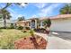 Charming single-story home with a red roof and well-maintained landscaping at 3058 Curry Ter, Port Charlotte, FL 33981