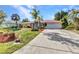 Well-maintained single-story home with a spacious driveway and inviting curb appeal at 3058 Curry Ter, Port Charlotte, FL 33981