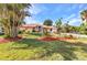 Charming home with well-maintained landscaping, creating a welcoming curb appeal at 3058 Curry Ter, Port Charlotte, FL 33981