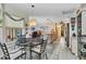 Open-concept kitchen and dining area with modern appliances and stylish decor at 3058 Curry Ter, Port Charlotte, FL 33981