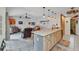 Kitchen with a large island, stainless appliances, and an open living area at 3058 Curry Ter, Port Charlotte, FL 33981