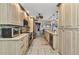 Open kitchen with modern appliances and ample cabinet space, seamlessly connected to the dining area at 3058 Curry Ter, Port Charlotte, FL 33981