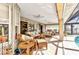 Spacious screened lanai with wicker furniture, ceiling fans, and outdoor living spaces at 3058 Curry Ter, Port Charlotte, FL 33981