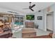 Comfortable living room with a view of the pool and access to the patio at 3058 Curry Ter, Port Charlotte, FL 33981