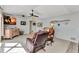 Bright living room featuring vaulted ceilings and coastal decor and comfortable seating at 3058 Curry Ter, Port Charlotte, FL 33981