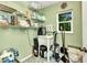 Functional utility room with sink, storage shelves, and a window for natural light at 3058 Curry Ter, Port Charlotte, FL 33981
