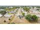 Expansive aerial view of a residential neighborhood, showcasing the property's location amidst lush greenery at 3342 Avanti Cir, North Port, FL 34287