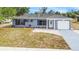 Inviting single-Gathering home featuring an attached garage, well-kept lawn, and charming curb appeal at 3342 Avanti Cir, North Port, FL 34287