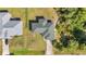 An aerial view of a home with a new roof, lush landscaping, and a private driveway at 3647 Culpepper Ter, North Port, FL 34286
