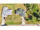 Overhead shot of property featuring a modern roof, a private driveway, and lush greenery at 3647 Culpepper Ter, North Port, FL 34286