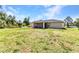 Well-maintained backyard with a screened lanai and ample greenery at 3647 Culpepper Ter, North Port, FL 34286
