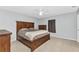 A bedroom featuring a ceiling fan, tile flooring, and hardwood furniture at 3647 Culpepper Ter, North Port, FL 34286