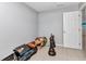 Bedroom featuring tile flooring, a white door and clutter on the floor at 3647 Culpepper Ter, North Port, FL 34286