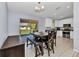 Eat-in dining area features a dining table, bench, and sliding doors to the outdoors at 3647 Culpepper Ter, North Port, FL 34286