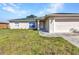 Lovely single-story home with a well-maintained lawn, two-car garage, and inviting front entrance at 3647 Culpepper Ter, North Port, FL 34286