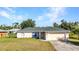 Well-maintained single-Gathering home featuring a new roof, manicured lawn, and attached garage at 3647 Culpepper Ter, North Port, FL 34286