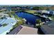 Stunning aerial view of waterfront property with lush landscaping and boat docks along a deep water canal at 432 Gun Cay Ln, Punta Gorda, FL 33950