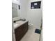 Modern bathroom with granite countertop vanity and glass shower at 432 Gun Cay Ln, Punta Gorda, FL 33950
