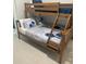 Cozy bedroom featuring a charming wooden bunk bed and stylish decor at 432 Gun Cay Ln, Punta Gorda, FL 33950