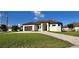 Charming single-story home with well-manicured lawn and brick paver driveway at 432 Gun Cay Ln, Punta Gorda, FL 33950