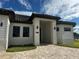 Beautiful front entrance to this property featuring custom brickwork and a modern, covered entryway at 432 Gun Cay Ln, Punta Gorda, FL 33950