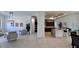 Spacious and well-lit open-concept living room flowing into a modern kitchen area at 432 Gun Cay Ln, Punta Gorda, FL 33950